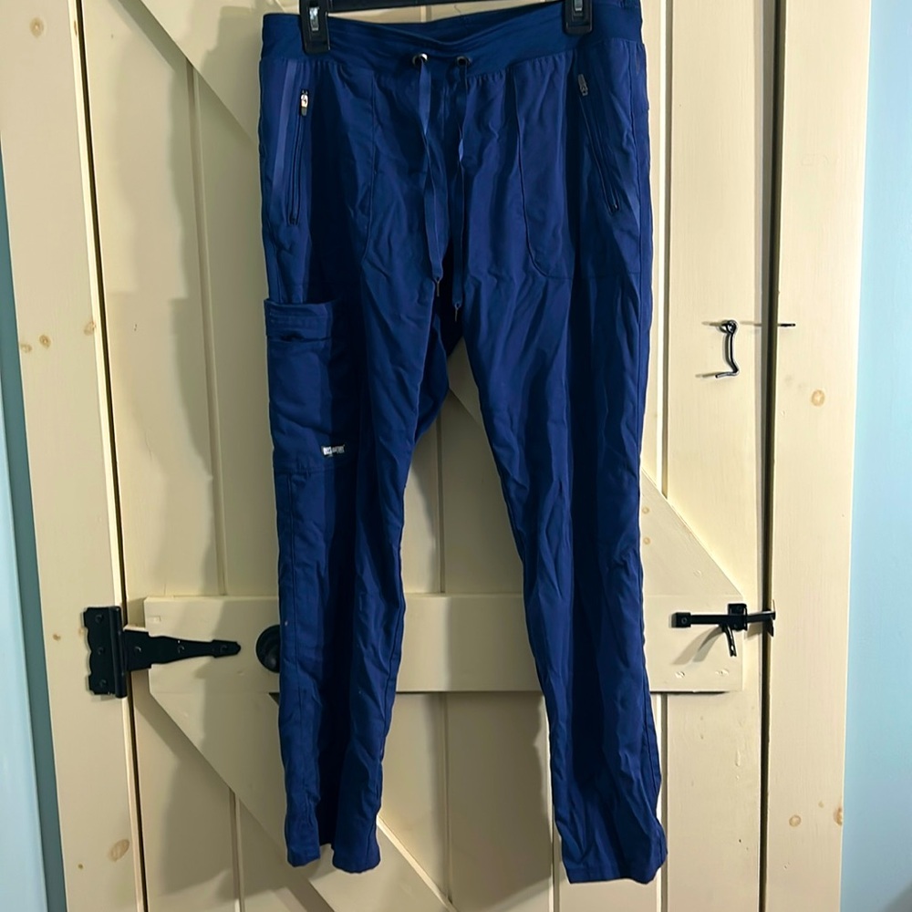 Grey’s Anatomy, navy blue, size MP, 6 pockets, gently used, excellent condition.